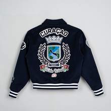 Load image into Gallery viewer, Navy blue jacket with 'Curacao' emblem on a light gray background