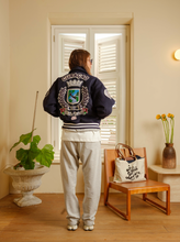 Load image into Gallery viewer, Curaçao to the World - Kokolishi Varsity Jacket
