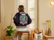 Load image into Gallery viewer, Curaçao to the World - Kokolishi Varsity Jacket