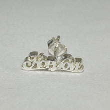 Load image into Gallery viewer, A sterling silver earring featuring the word 'She' in a cursive script with a small horse silhouette integrated into the design, shown from the back on a light gray background.
