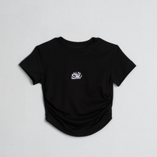 Load image into Gallery viewer, Black t-shirt with a white logo on a light gray background

